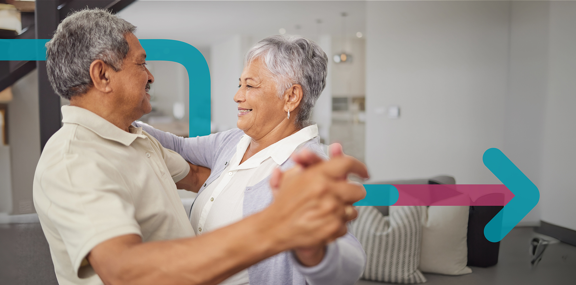 An elderly couple dancing together