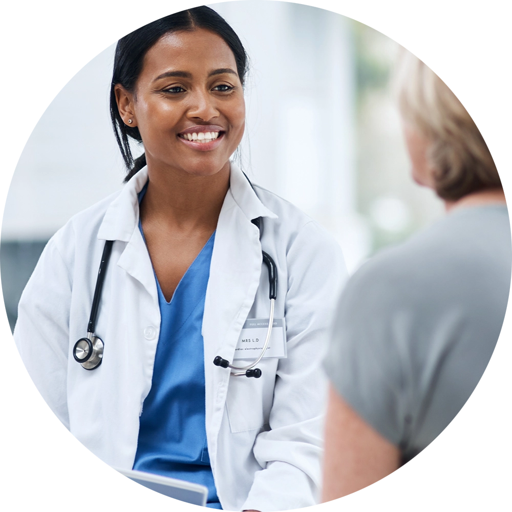 A smiling doctor consulting with her patient